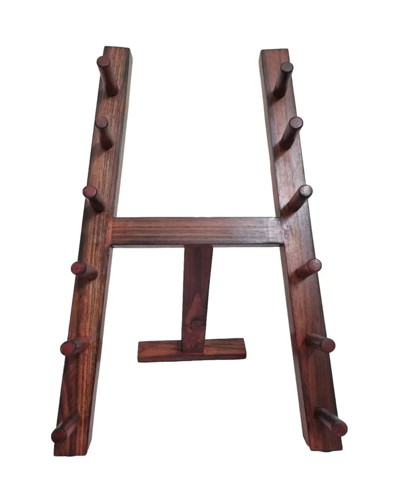 A dark brown Japanese Style Wooden Knife Rack Stand Brown rack with multiple cylindrical pegs on both vertical arms and a small horizontal support at the bottom, shown against a plain white background.