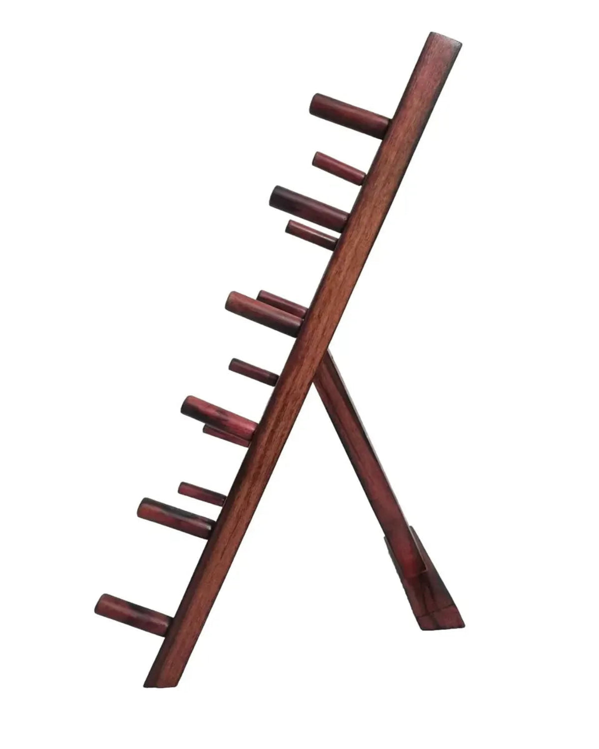 A dark reddish-brown wooden wine bottle rack with multiple angled pegs, shown on a plain white background.