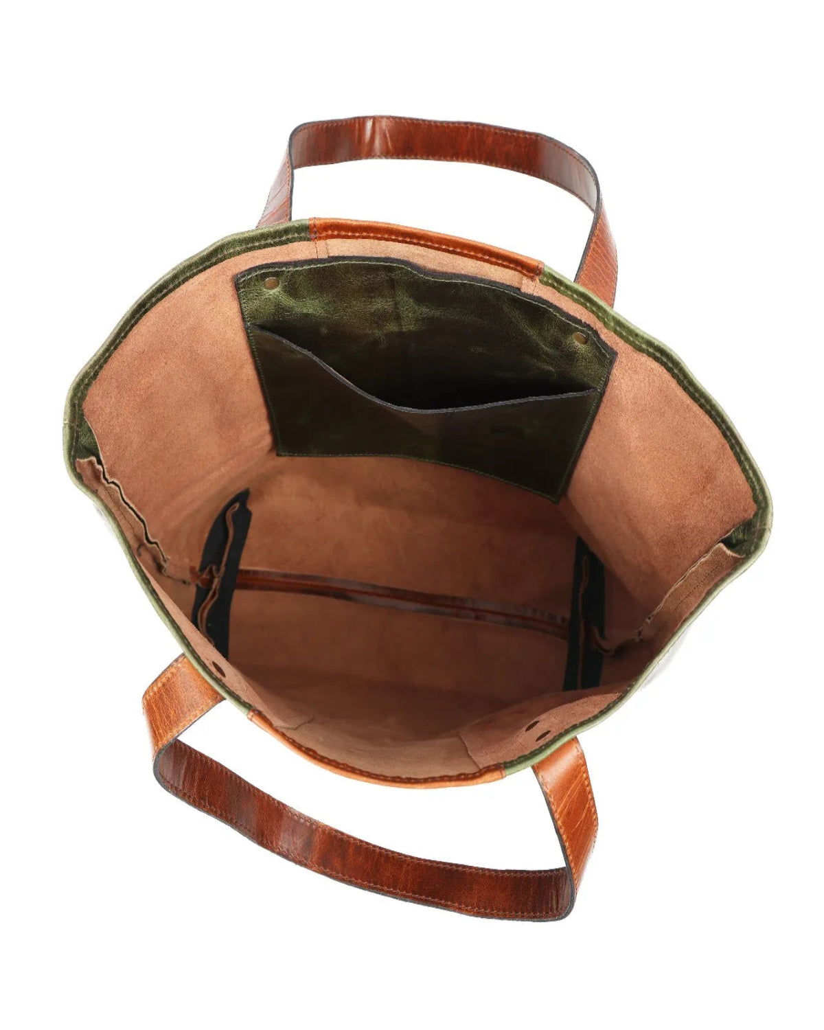 An overhead view of a tote bag's open top interior, showing a tan leather interior, a dark green velvet interior lining, and brown leather handles on a white background.